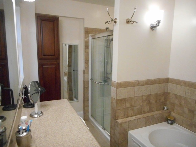 4766 Graham Road Somonauk, IL 60552 - Photo 13 of 25 a bathroom with a sink a toilet and shower