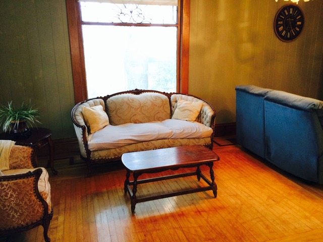 4766 Graham Road Somonauk, IL 60552 - Photo 6 of 25 a blue couch sitting in a room next to a window