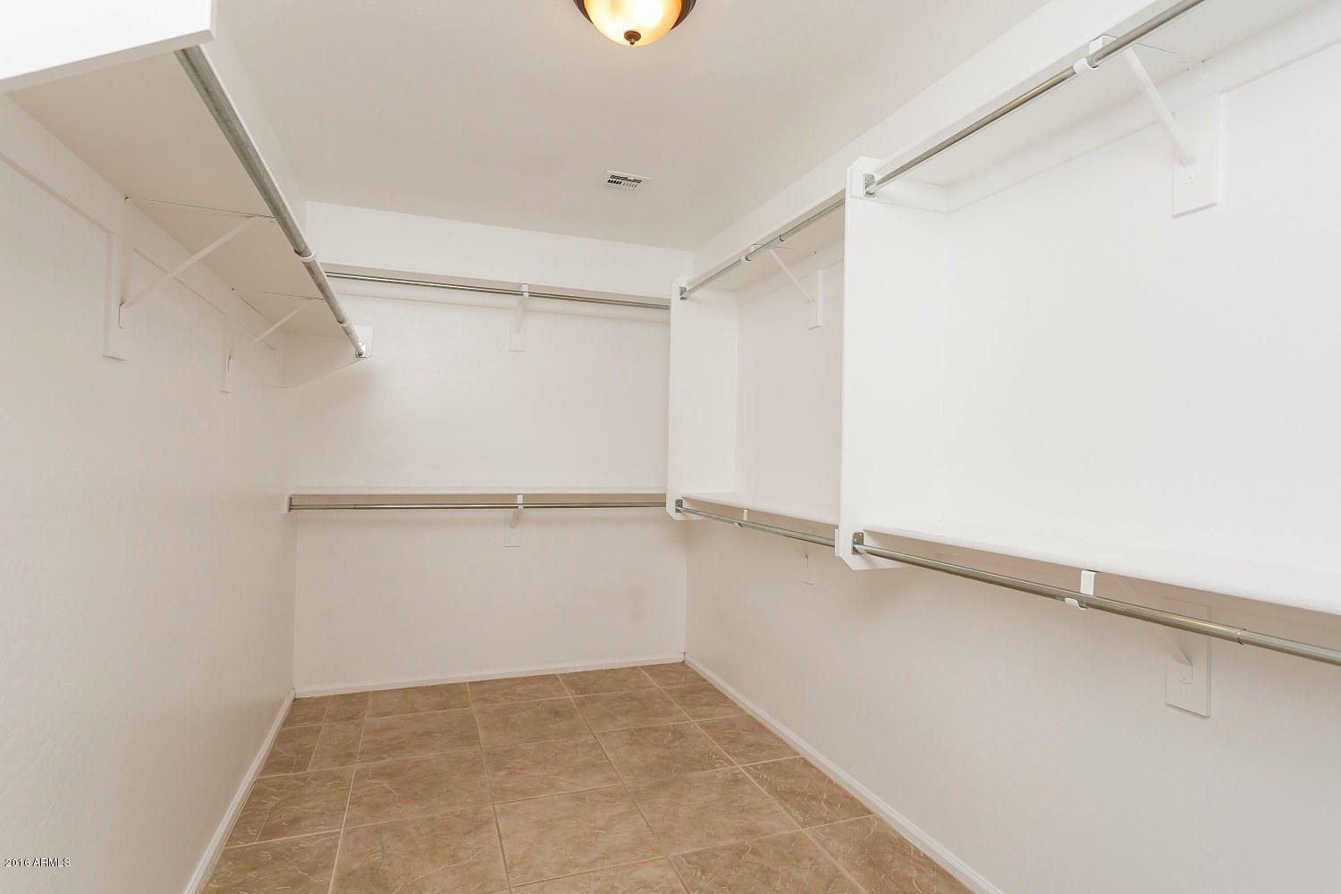 4625 West Carson Road Laveen, AZ 85339 - Photo 12 of 19 a view of an empty walk in closet