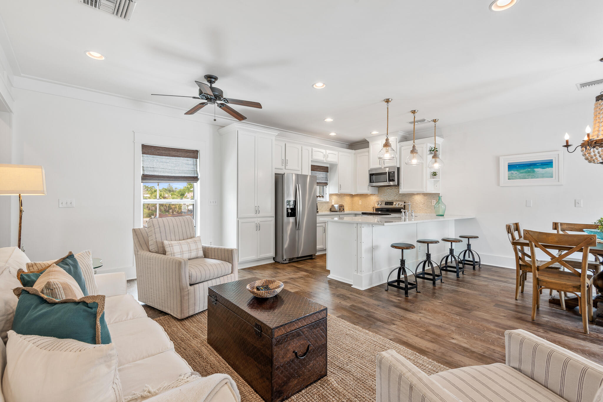 139 Brown Street Santa Rosa Beach, FL 32459 - Photo 13 of 45 a living room with furniture kitchen view and a refrigerator