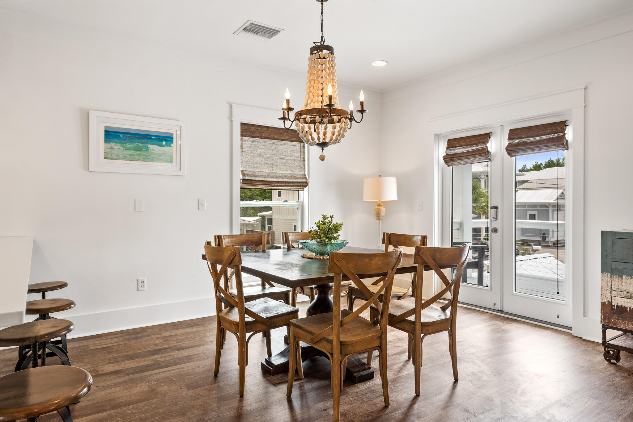 139 Brown Street Santa Rosa Beach, FL 32459 - Photo 14 of 45 a view of a dining room with furniture window and wooden floor