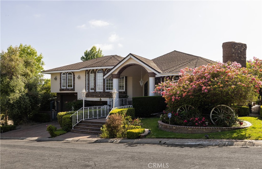 26421 Broken Bit Lane Laguna Hills, CA 92653 - Photo 1 of 15 a front view of a house with garden