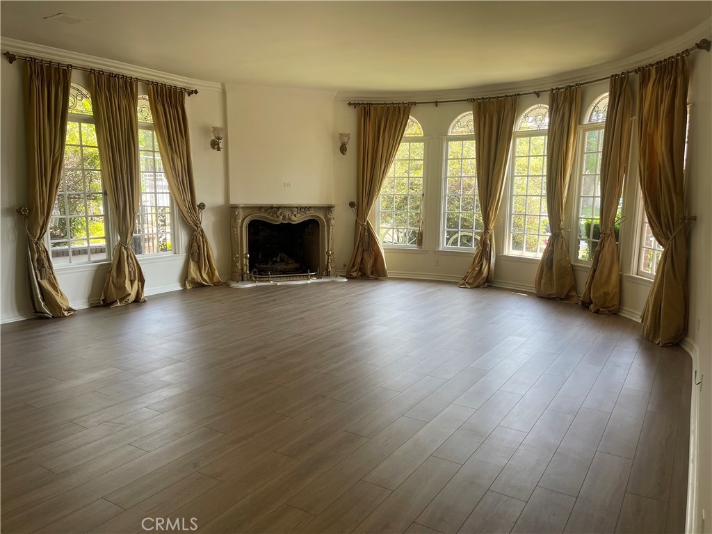 26421 Broken Bit Lane Laguna Hills, CA 92653 - Photo 4 of 15 a view of an empty room with wooden floor and a window