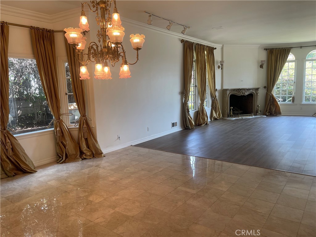 26421 Broken Bit Lane Laguna Hills, CA 92653 - Photo 5 of 15 a view of a livingroom with wooden floor and fireplace