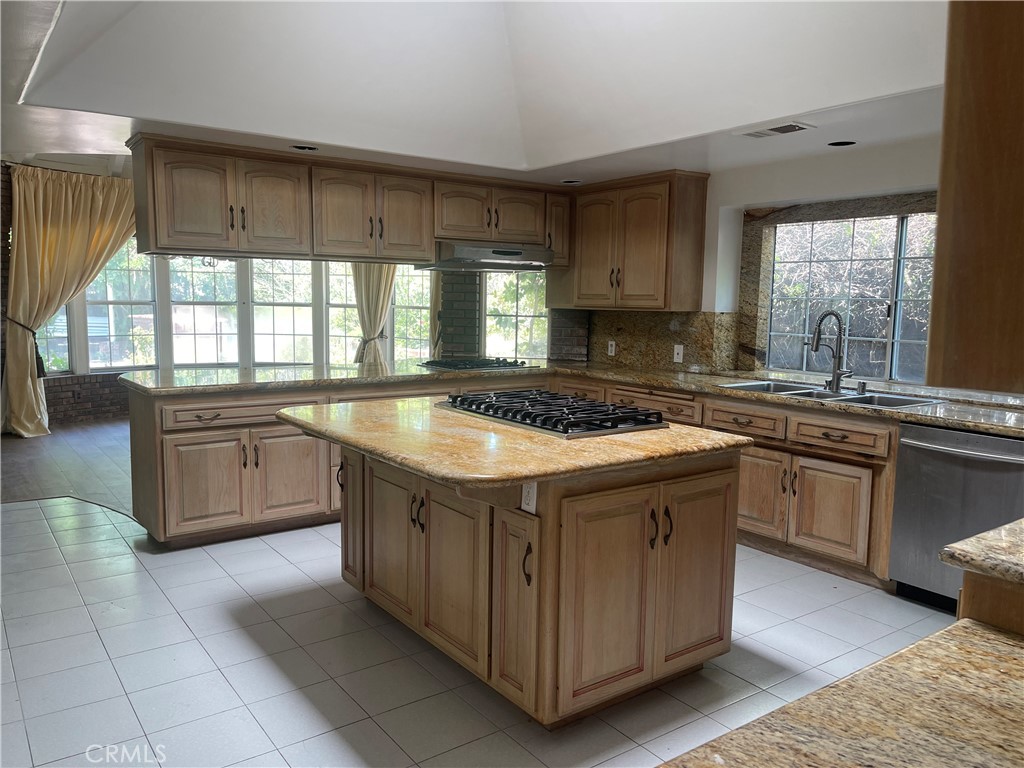 26421 Broken Bit Lane Laguna Hills, CA 92653 - Photo 6 of 15 a kitchen with a sink stove and cabinets