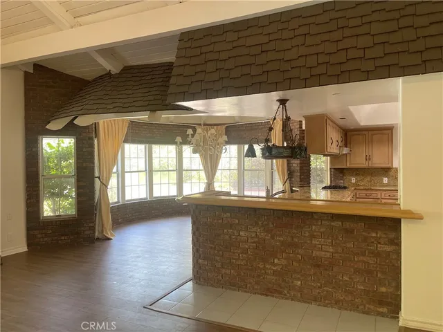 a kitchen with stainless steel appliances granite countertop a sink and cabinets