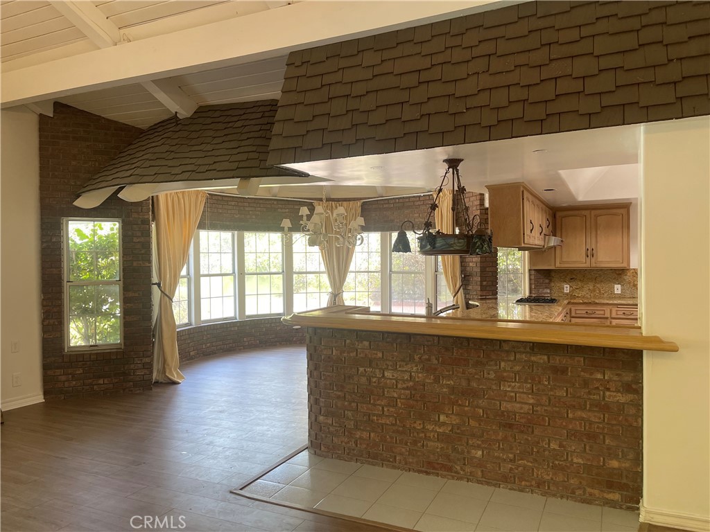 26421 Broken Bit Lane Laguna Hills, CA 92653 - Photo 7 of 15 a kitchen with stainless steel appliances granite countertop a sink and cabinets