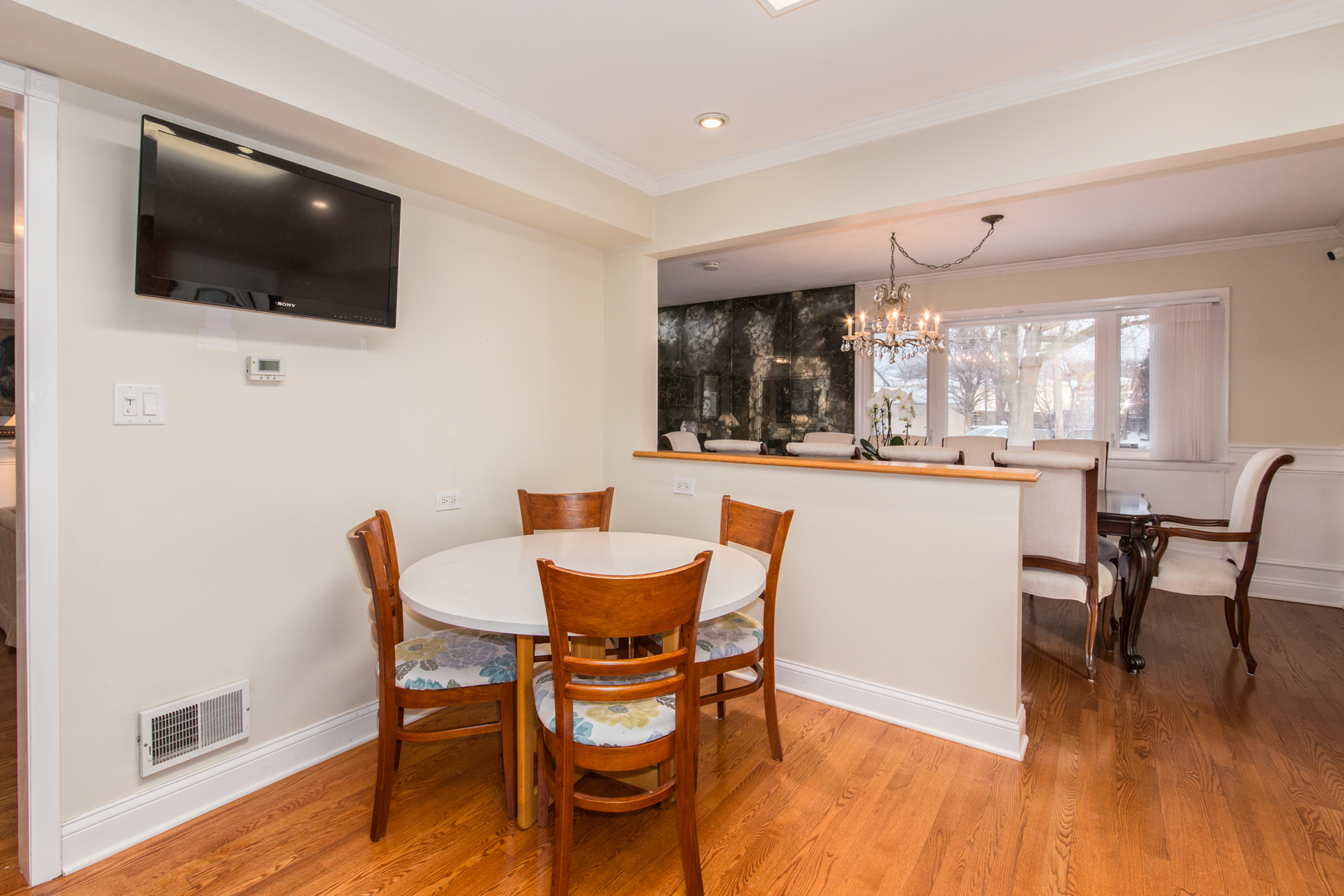 1026 Fortuna Avenue Park Ridge, IL 60068 - Photo 15 of 43 a view of a dining room with furniture and wooden floor