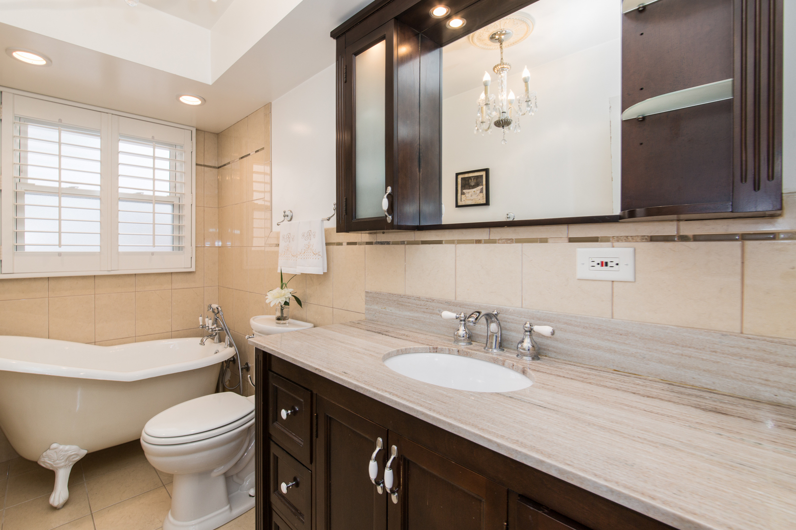 1026 Fortuna Avenue Park Ridge, IL 60068 - Photo 20 of 43 a bathroom with a granite countertop toilet sink and mirror