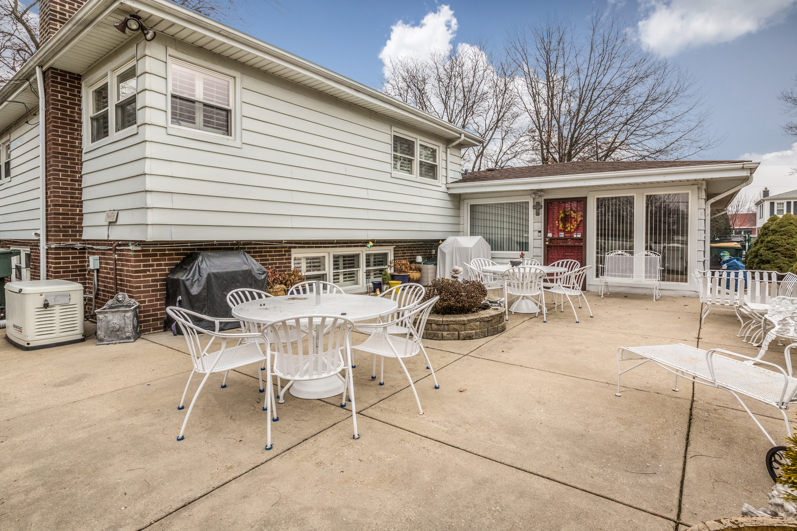 1026 Fortuna Avenue Park Ridge, IL 60068 - Photo 3 of 43 a view of a patio with table and chairs with wooden fence and plants
