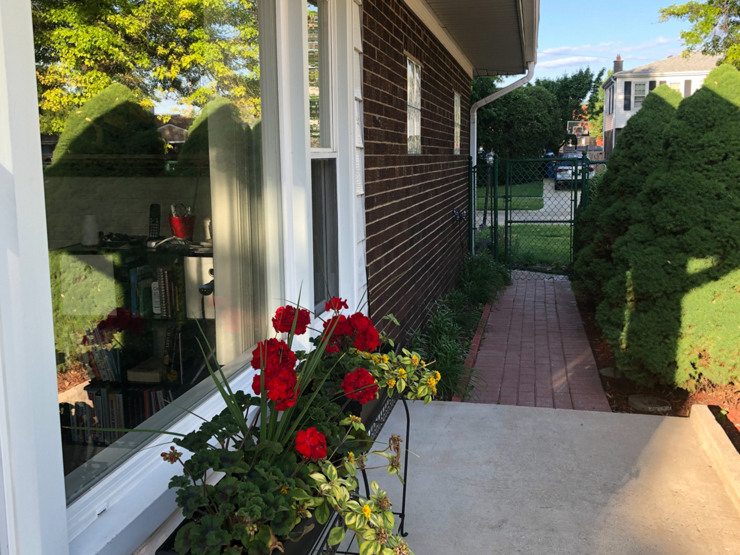 1026 Fortuna Avenue Park Ridge, IL 60068 - Photo 37 of 43 a vase of flowers sitting in front of a house