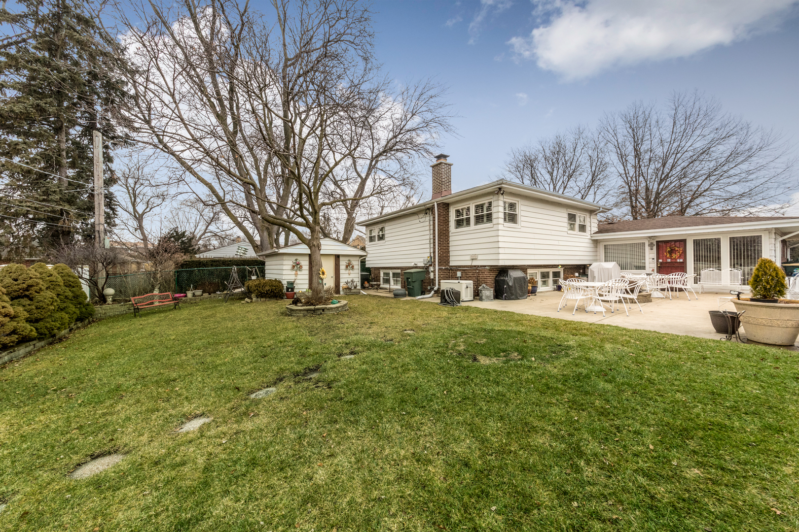1026 Fortuna Avenue Park Ridge, IL 60068 - Photo 4 of 43 a front view of a house with a garden and trees