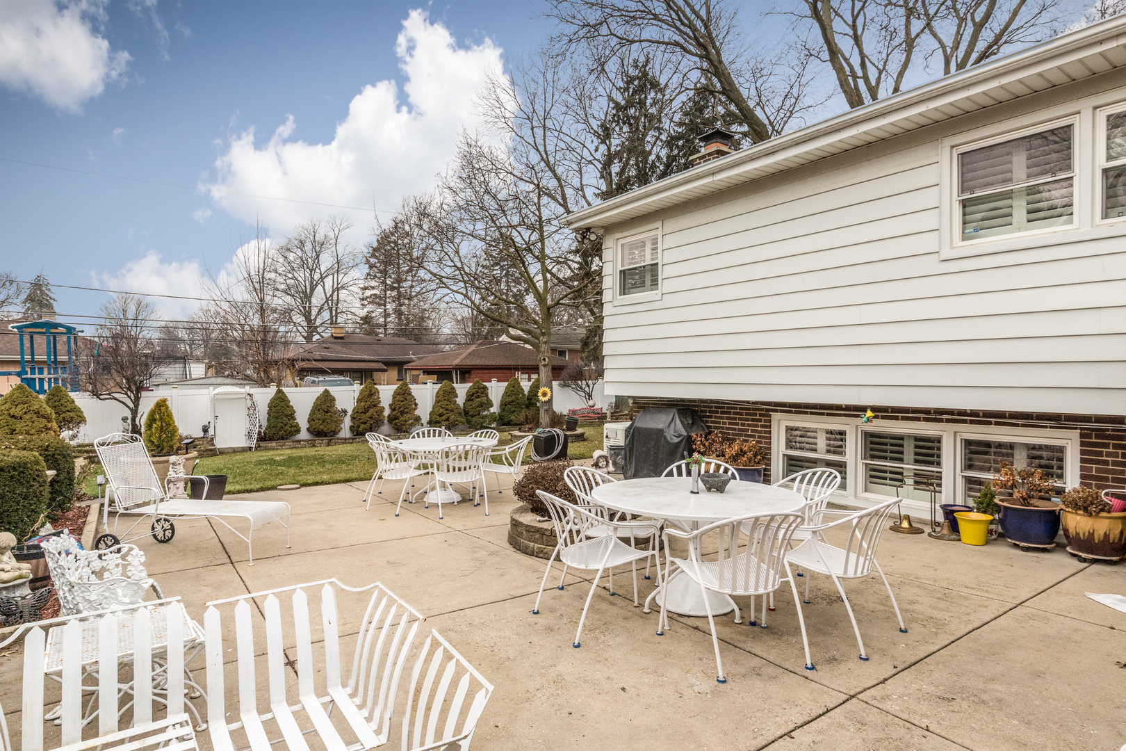 1026 Fortuna Avenue Park Ridge, IL 60068 - Photo 42 of 43 a view of a patio with table and chairs with wooden floor and fence