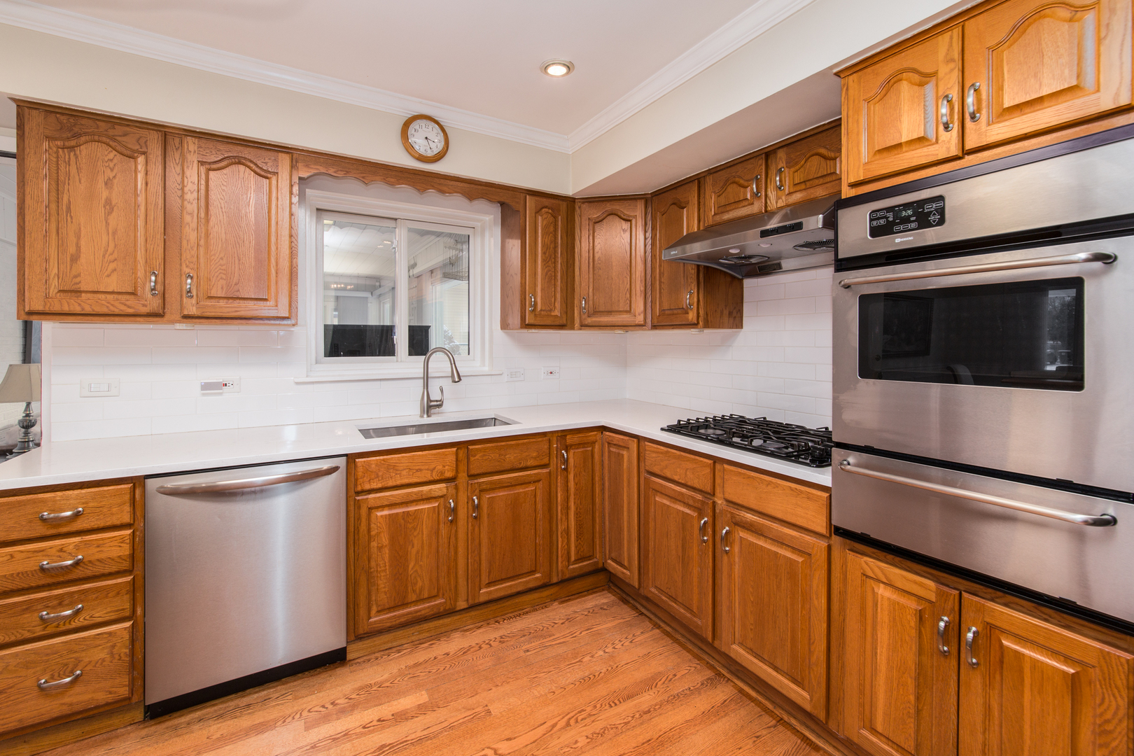 1026 Fortuna Avenue Park Ridge, IL 60068 - Photo 7 of 43 a kitchen with stainless steel appliances granite countertop a sink and cabinets