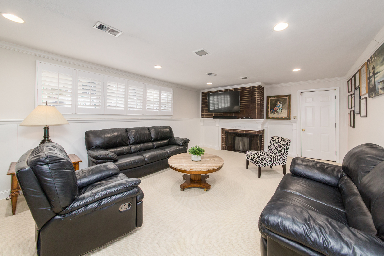 1026 Fortuna Avenue Park Ridge, IL 60068 - Photo 10 of 43 a living room with furniture a fireplace and a flat screen tv