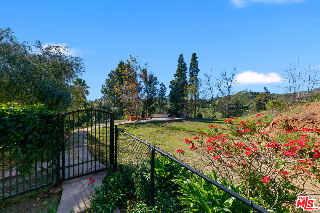 6070 Ramirez Canyon Road Malibu, CA 90265 - Photo 26 of 42 a view of a tennis court