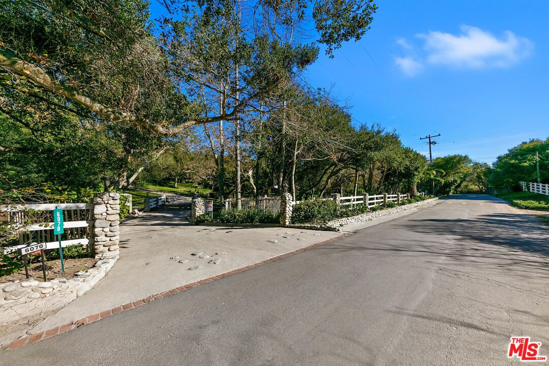 6070 Ramirez Canyon Road Malibu, CA 90265 - Photo 33 of 42 a wooden bench with view of tree