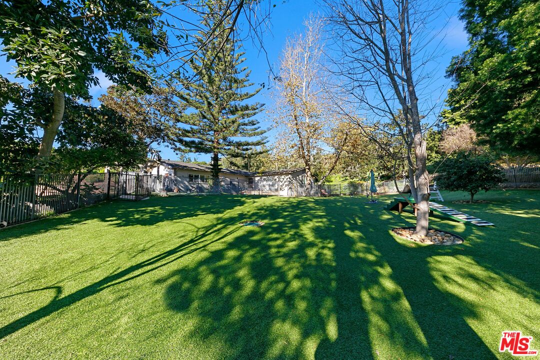 6070 Ramirez Canyon Road Malibu, CA 90265 - Photo 9 of 42 a backyard of a house with lots of green space