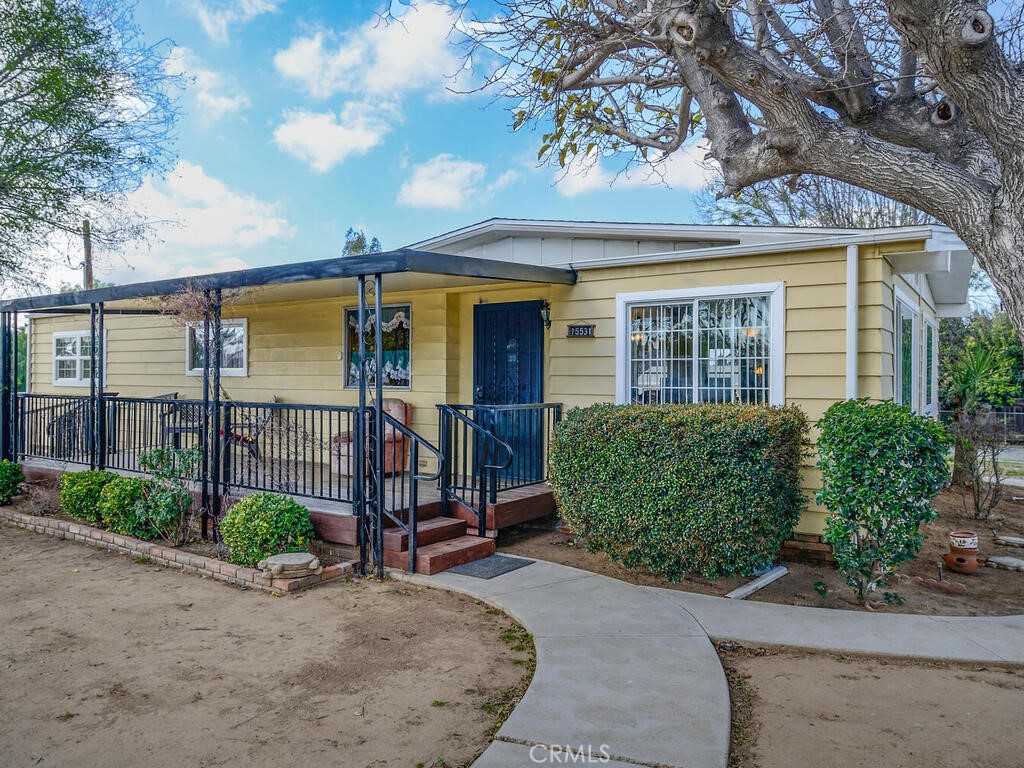 15531 Winchester Way Riverside, CA 92508 - Photo 1 of 1 front view of a house with a street