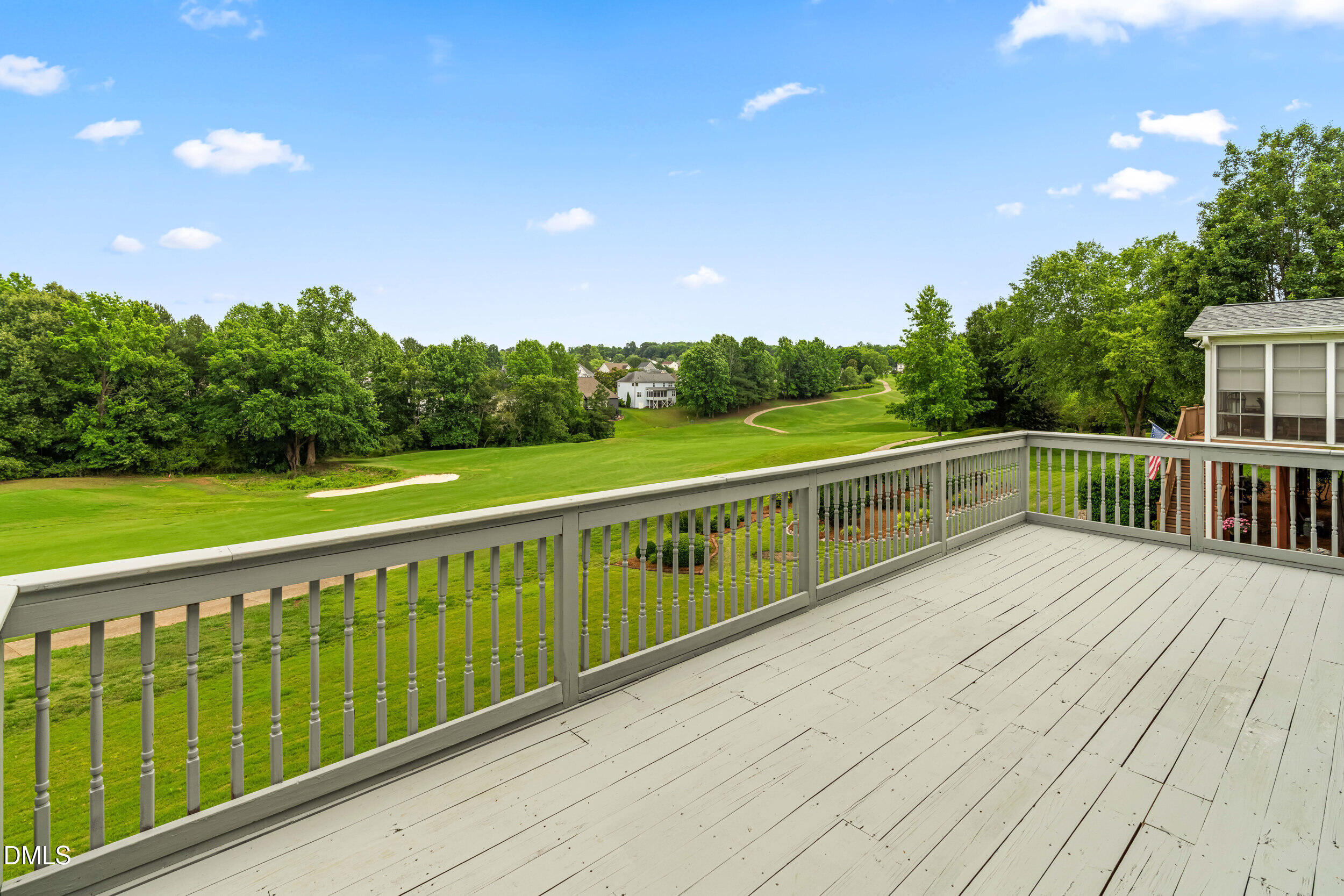 744 Seastone Street Raleigh, NC 27603 - Photo 43 of 53 a view of balcony with wooden floor and fence
