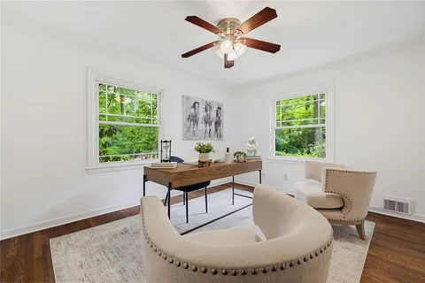 a view of a room with wooden floor