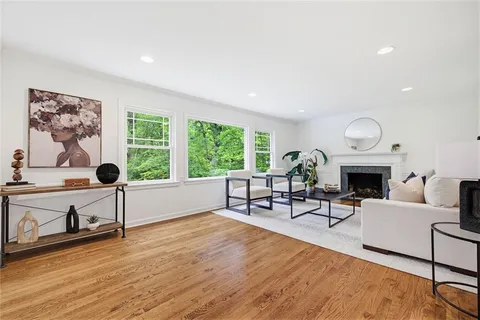 a kitchen with stainless steel appliances kitchen island granite countertop a refrigerator and a stove top oven