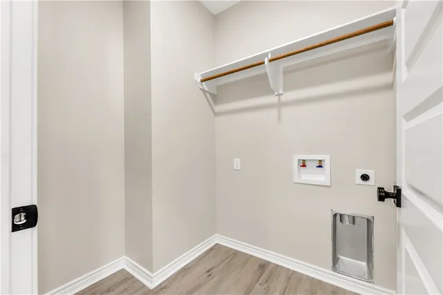 a bathroom with a granite countertop sink a toilet a mirror a vanity a bathtub and shower