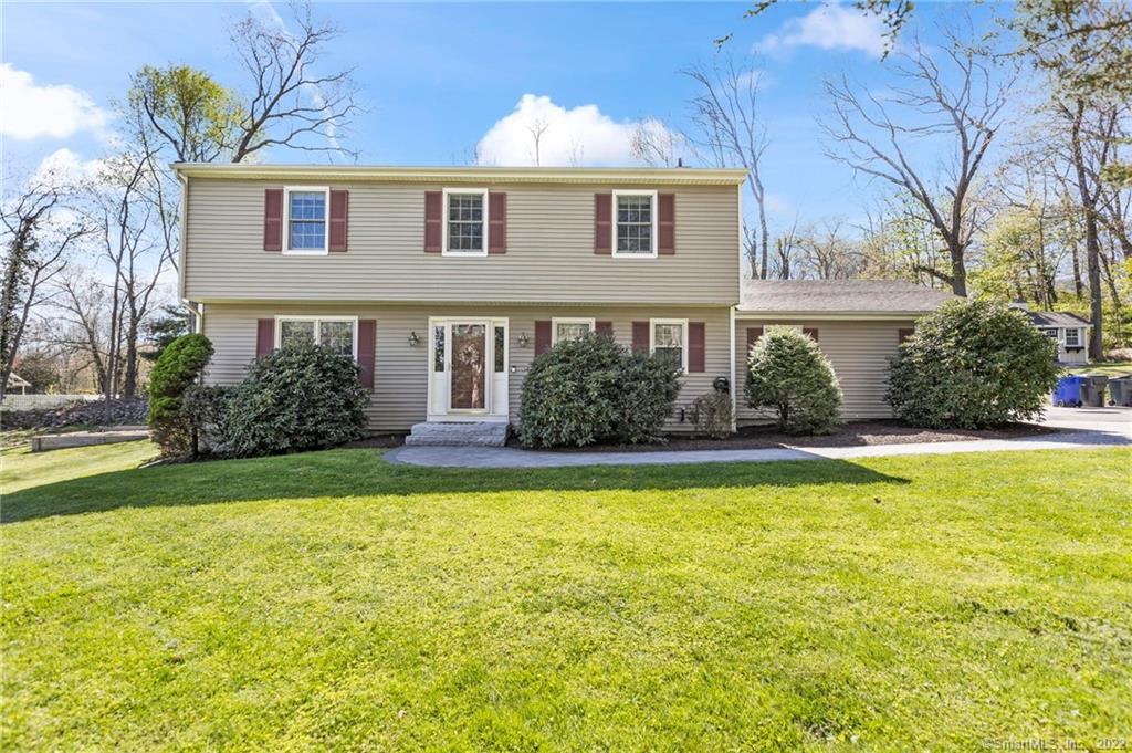 16 Weed Road Bethel, CT 06801 - Photo 1 of 1 a front view of house with yard and trees around