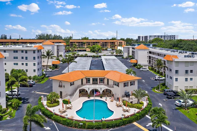 a view of a building with sitting area