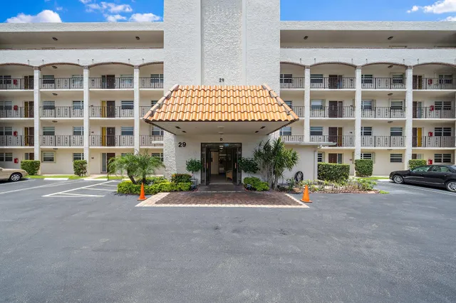 a view of hallway with wooden floor