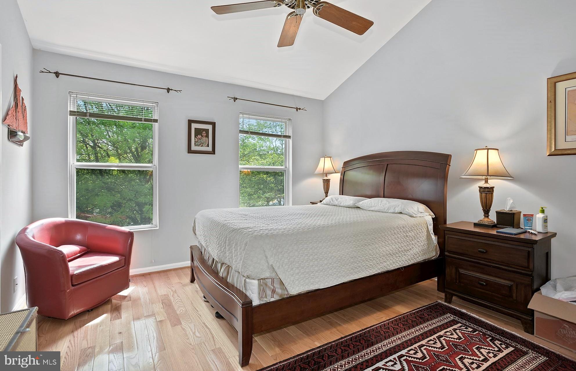 12062 Edgemere Circle Reston, VA 20190 - Photo 13 of 29 a bedroom with a bed and wooden floor