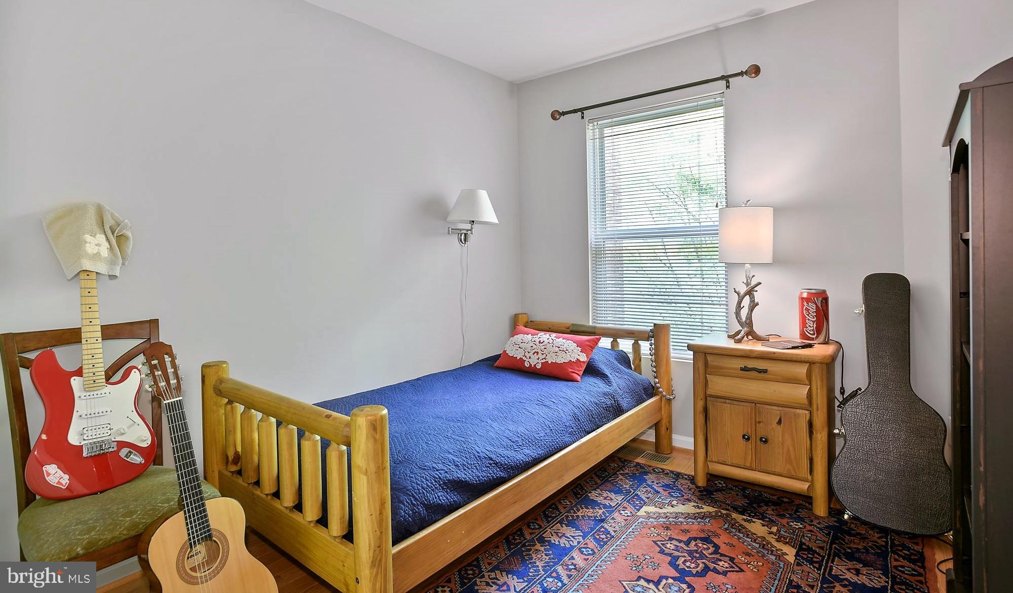 12062 Edgemere Circle Reston, VA 20190 - Photo 18 of 29 a bedroom with a bed and wooden floor