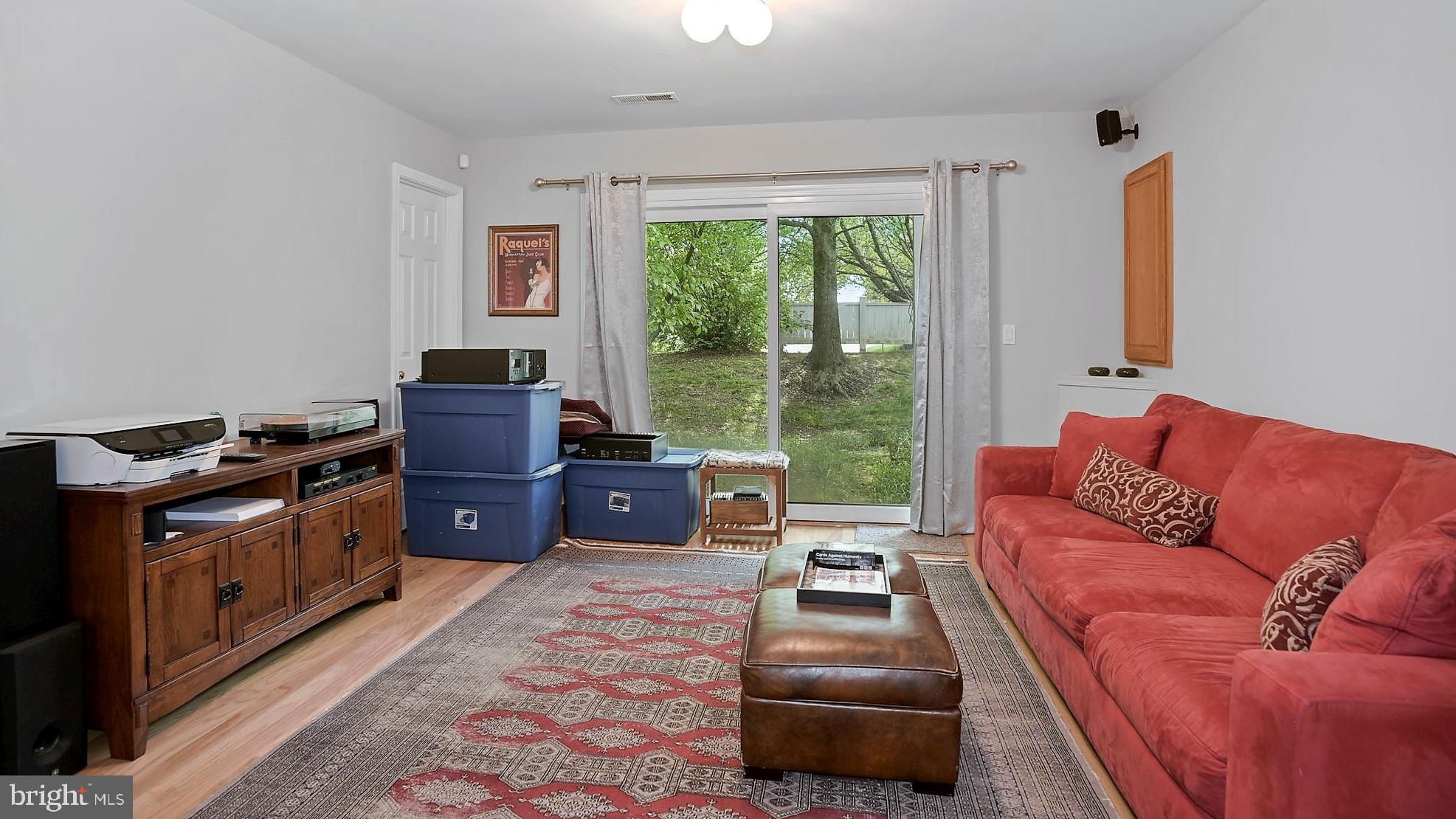 12062 Edgemere Circle Reston, VA 20190 - Photo 20 of 29 a living room with furniture and a flat screen tv
