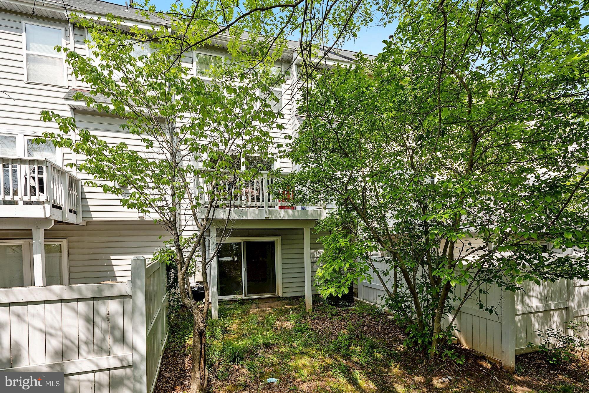 12062 Edgemere Circle Reston, VA 20190 - Photo 23 of 29 a front view of a house with a garden