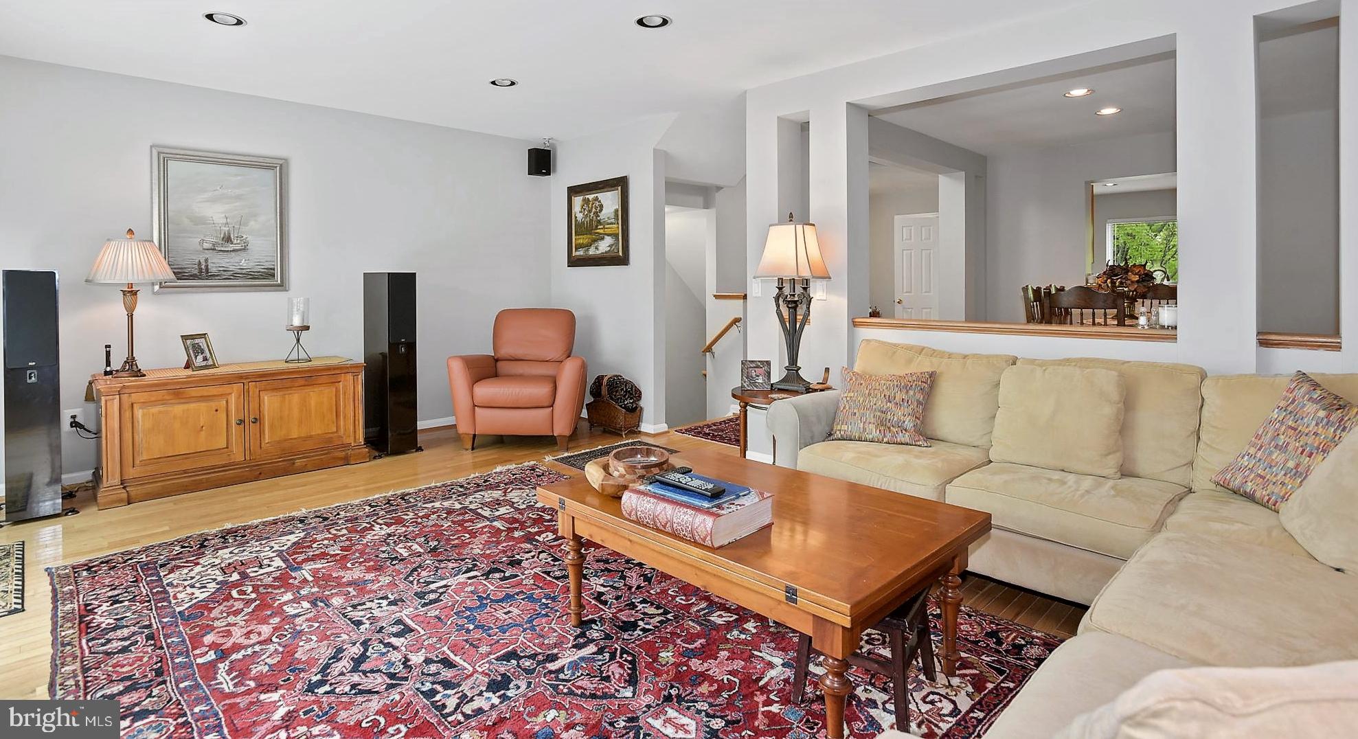 12062 Edgemere Circle Reston, VA 20190 - Photo 8 of 29 a living room with furniture and wooden floor