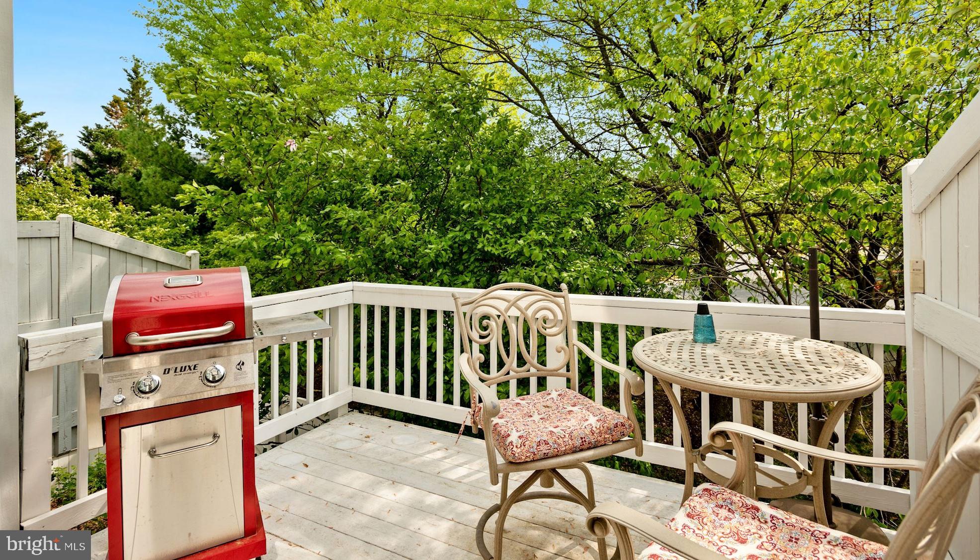 12062 Edgemere Circle Reston, VA 20190 - Photo 9 of 29 a view of a patio with a table and chairs