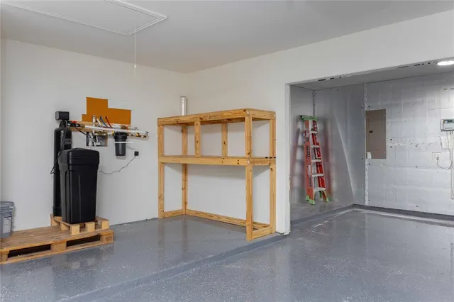 a view of a brick building with wooden fence