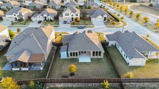 an aerial view of a houses with outdoor space