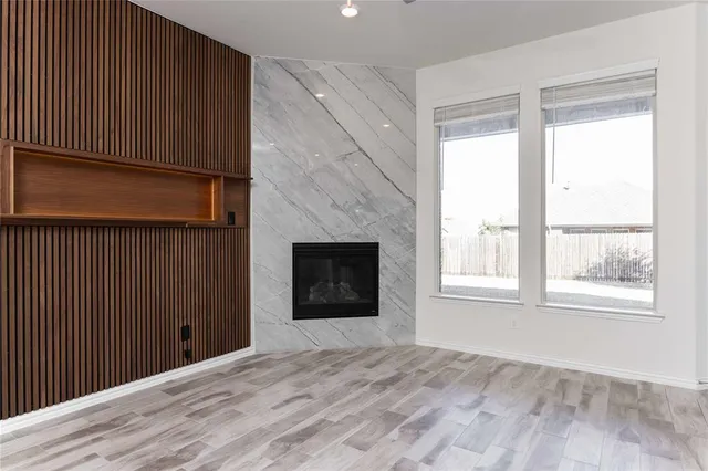 a view of kitchen with center island and wooden floor