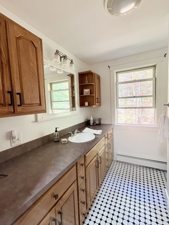 101 Russell Hill Road Ashburnham, MA 01430 - Photo 30 of 42 a bathroom with a sink a vanity and a window
