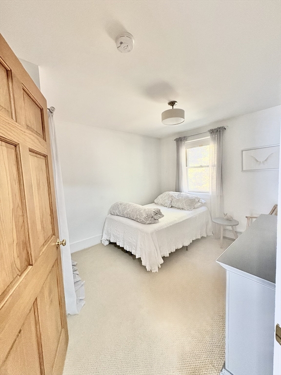 101 Russell Hill Road Ashburnham, MA 01430 - Photo 31 of 42 a spacious bedroom with a bed and a cabinets