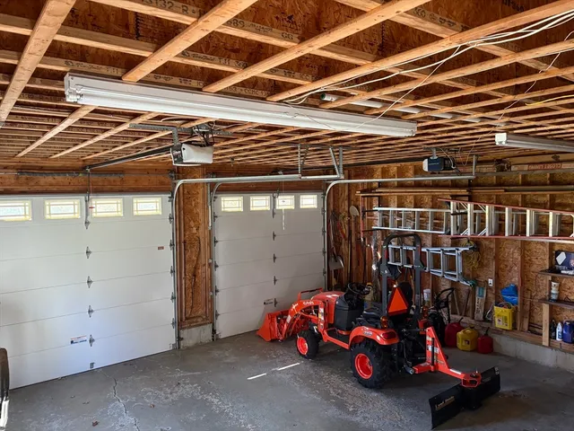 a view of a storage room with furniture and a window