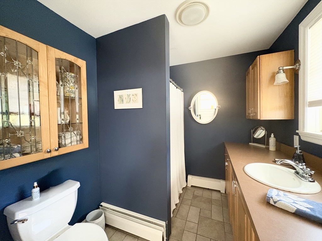 101 Russell Hill Road Ashburnham, MA 01430 - Photo 8 of 42 a bathroom with a toilet sink vanity granite and mirror