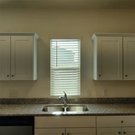a sink with granite top