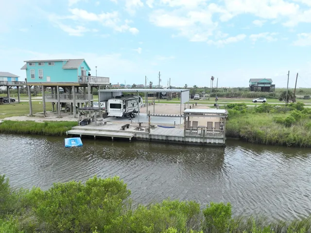 a view of a lake with boats and trees