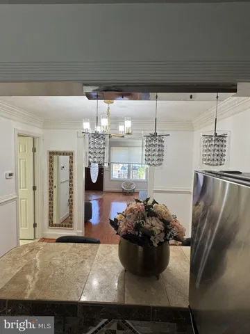 a kitchen with a table and chairs