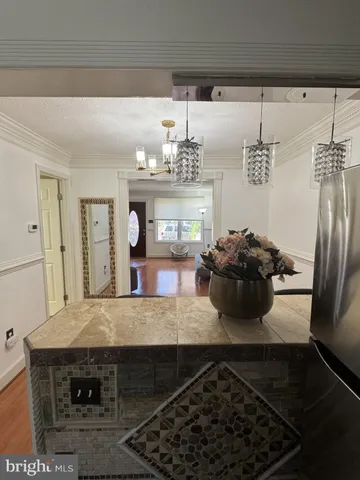 a kitchen with a sink appliances and cabinets