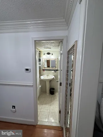 a bathroom with a sink and mirror