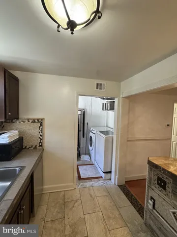 a view of a livingroom with furniture and front door