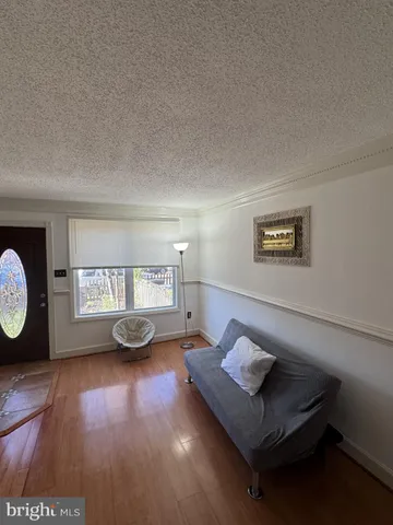a living room with chair and a table